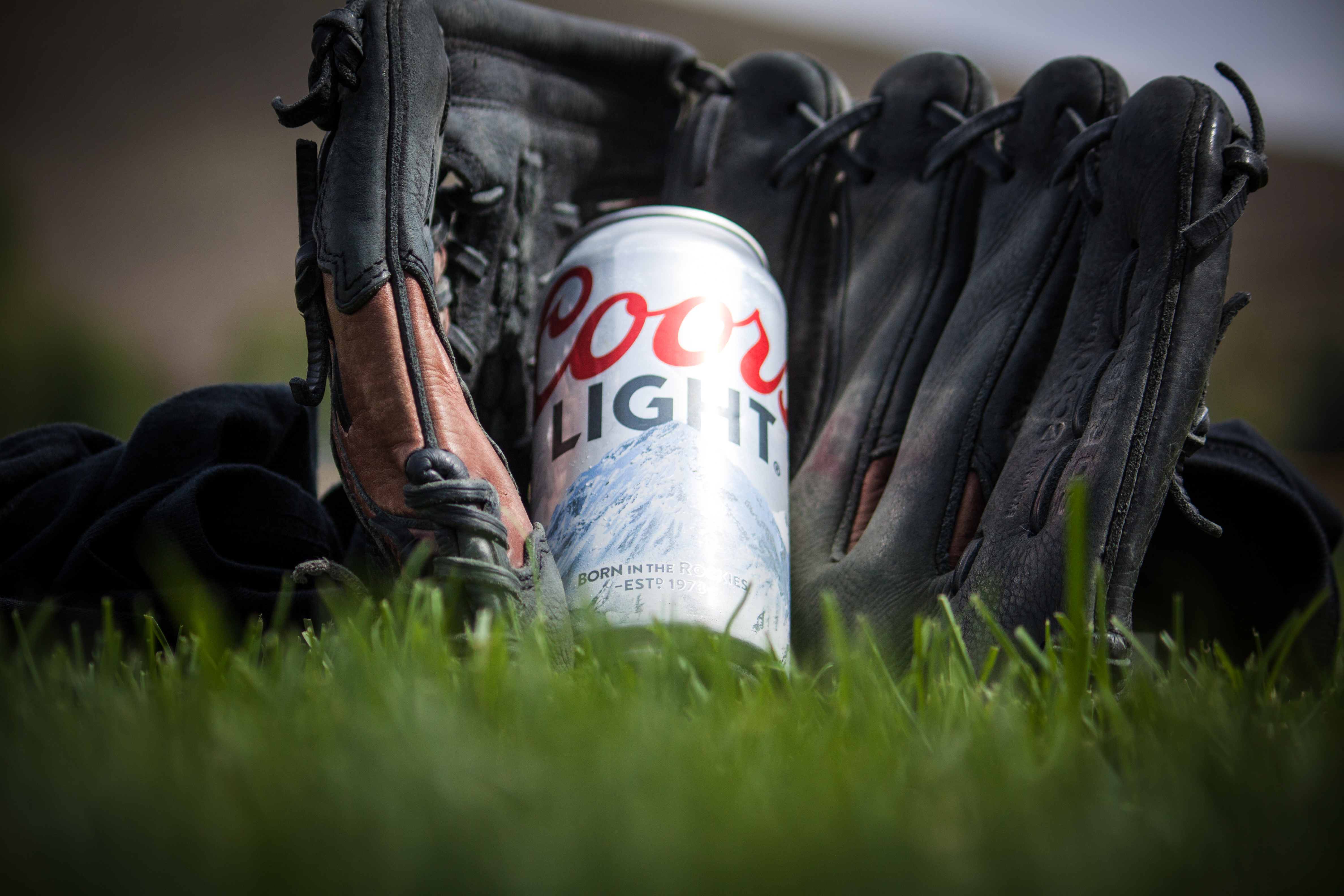 coors light can on black and brown baseball meth